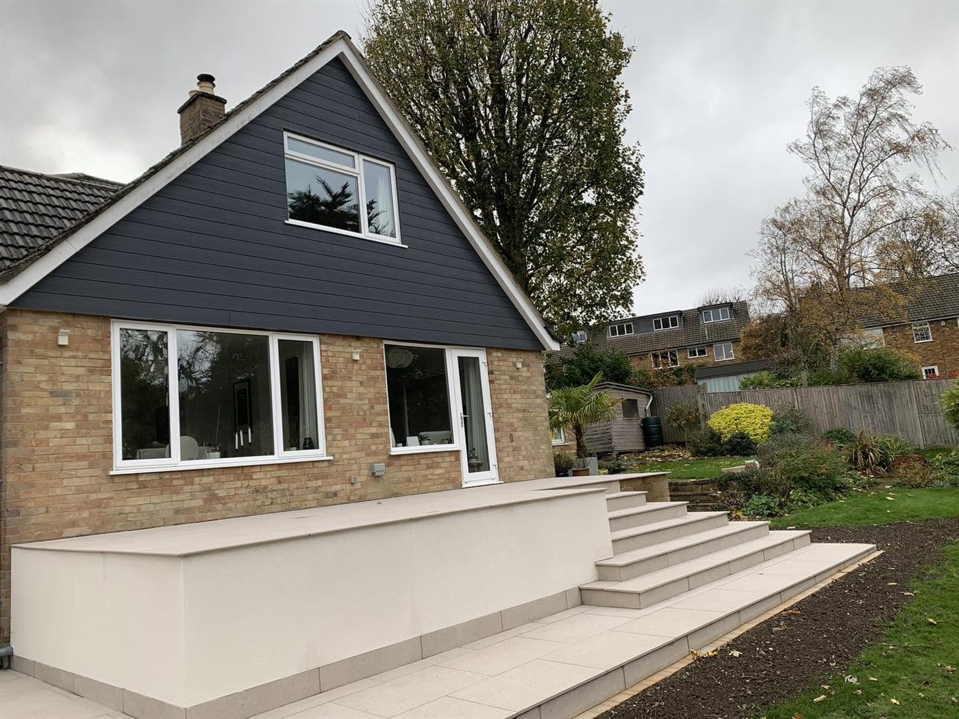 Porcelain paving and rendered walls at a house in Speen